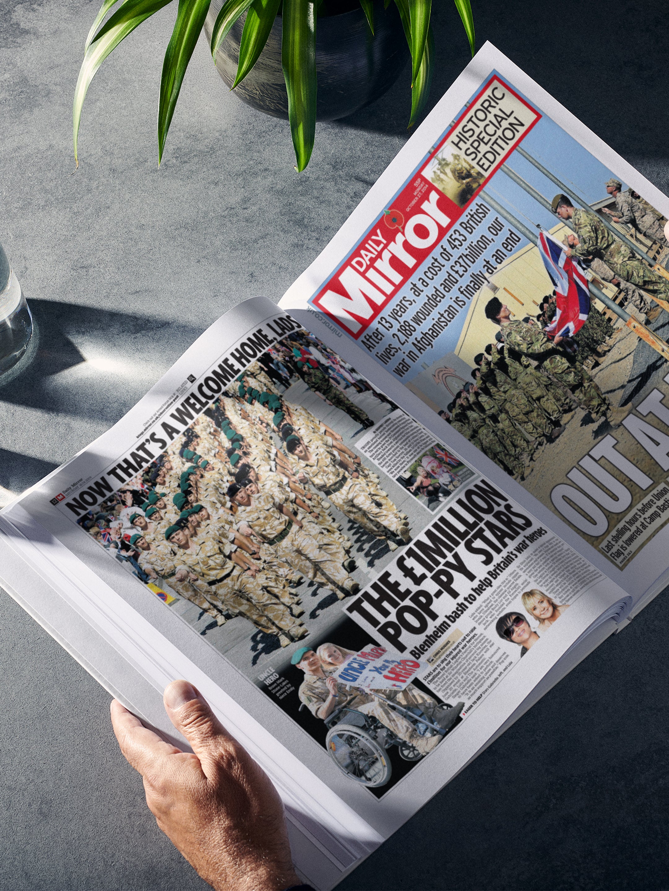 Open spread of "The History of The British Army" POD book by Historic Newspapers, showing historical military imagery and text.