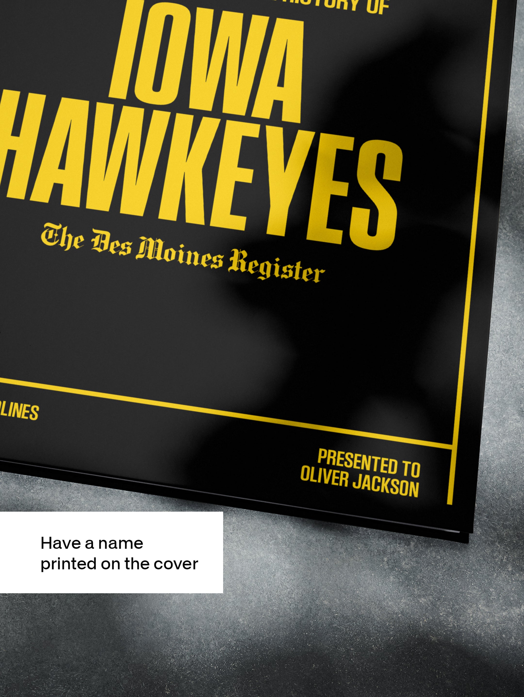 Black and white POD book cover of "The College Football History of Iowa Hawkeyes" by Historic Newspapers featuring football news.