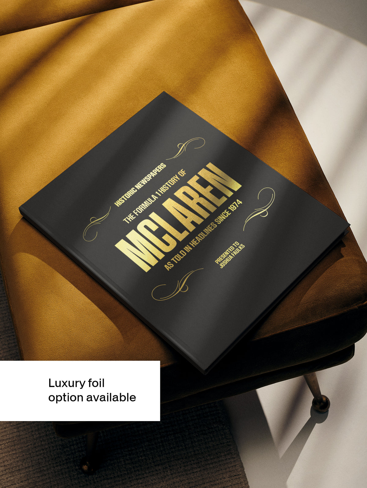 Black hardcover book titled "The Formula 1 History of McLaren" from Historic Newspapers, featuring images and history of the F1 team.