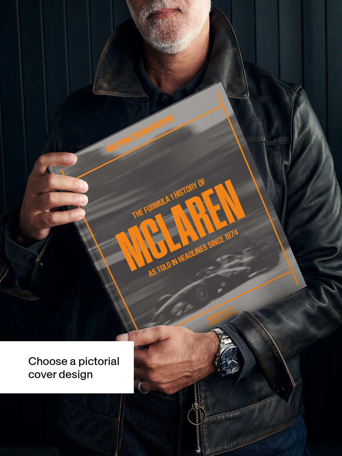 Black and white image of "The Formula 1 History of McLaren" POD book by Historic Newspapers on a newsstand.