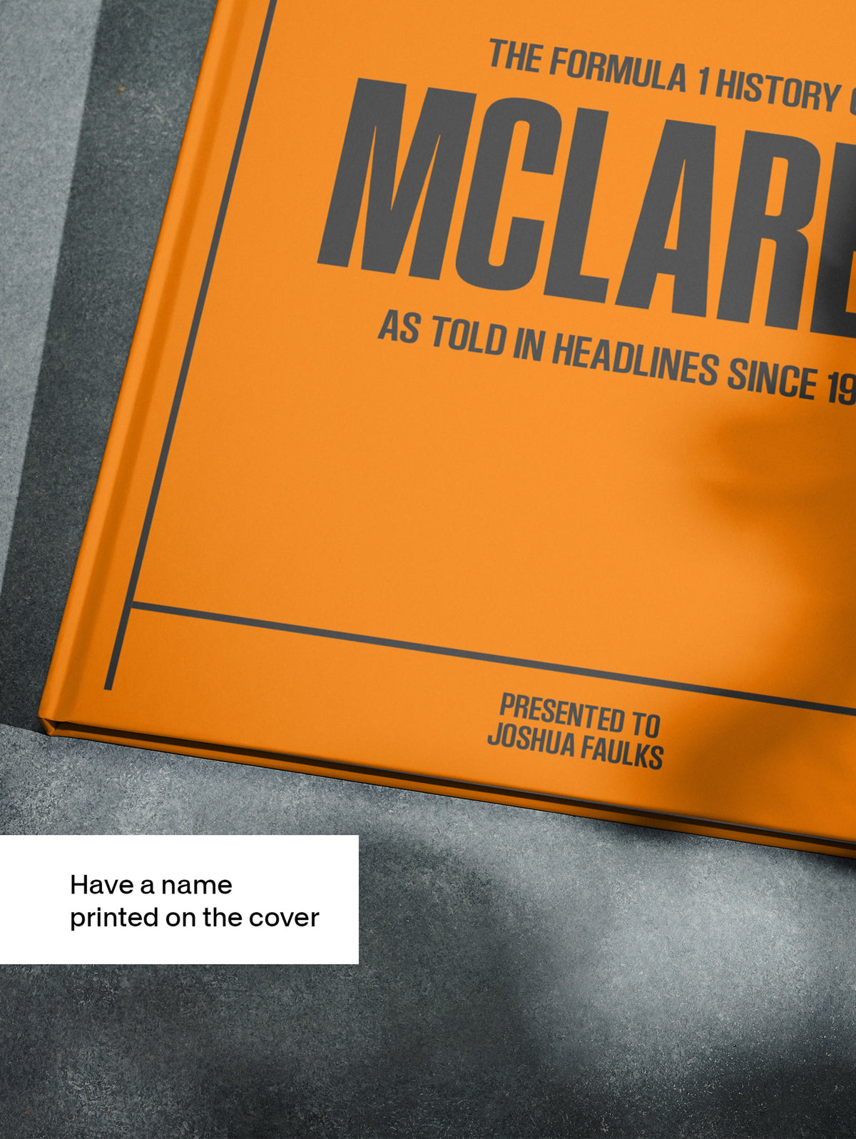 Cover of "The Formula 1 History of McLaren" POD book by Historic Newspapers, featuring McLaren racing team branding and vibrant orange design.