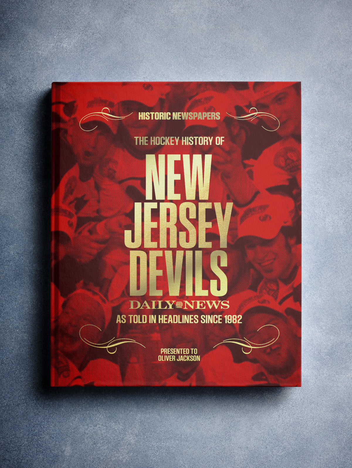 POD book titled "The Hockey History of New Jersey Devils" by Historic Newspapers, featuring a red foil cover and hockey imagery.
