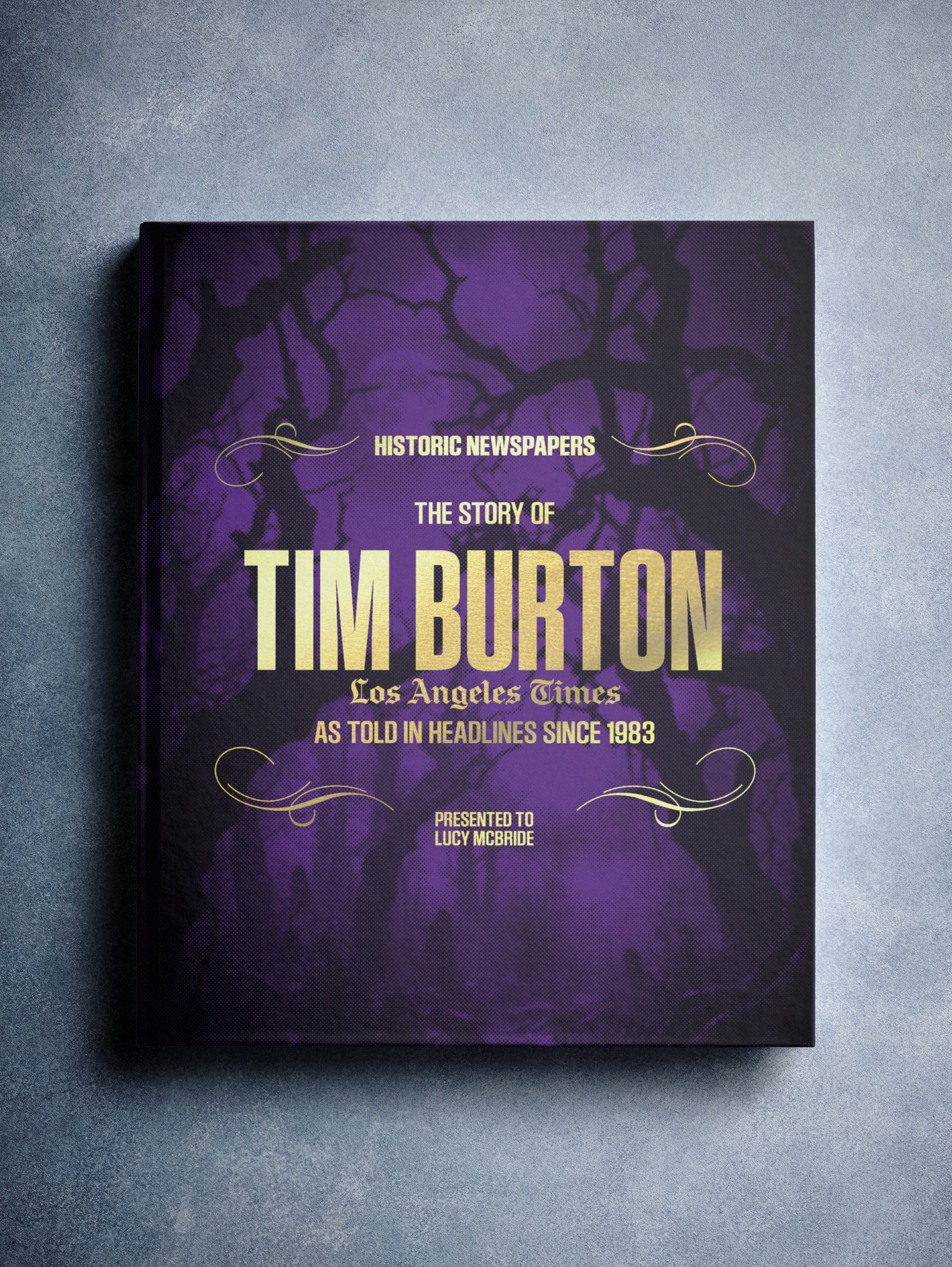 Purple foil cover of The Story of Tim Burton Los Angeles Times Edition POD book by Historic Newspapers with Tim Burton's portrait.