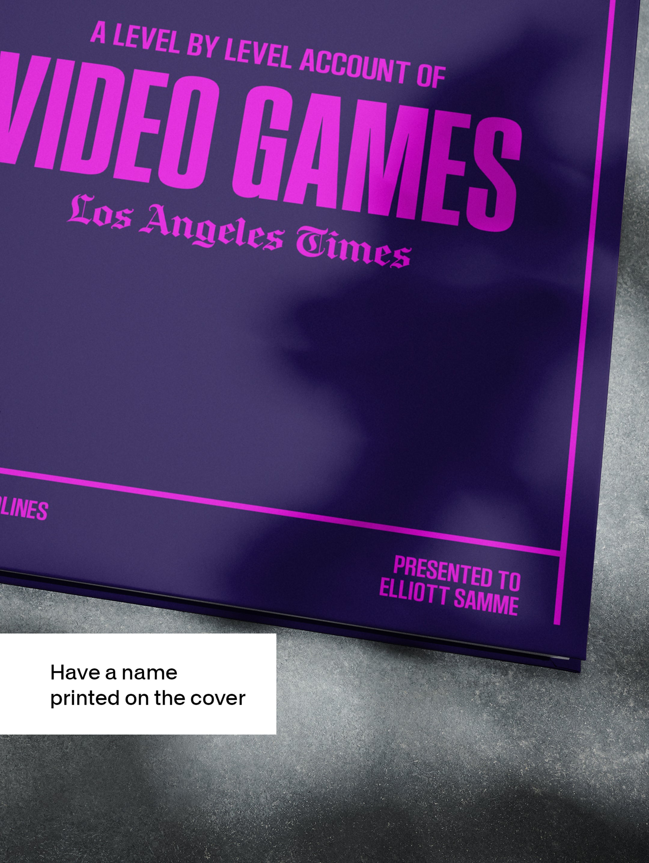 POD book titled "The History of Video Games" Los Angeles Times Edition by Historic Newspapers, displayed on a newsstand with purple cover.