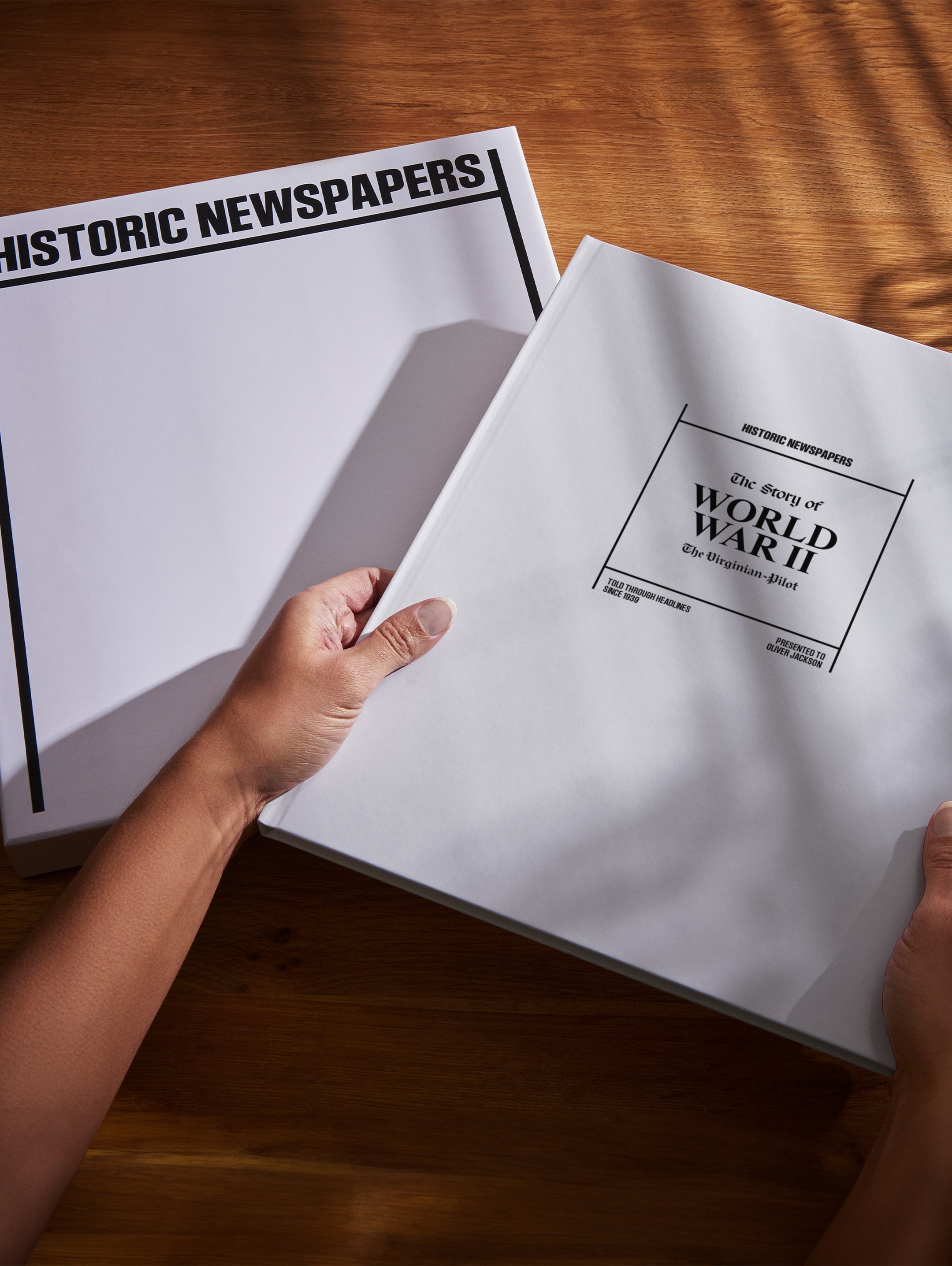 POD book titled "The History of World War II" by Historic Newspapers, shown in a white gift box with vintage design.