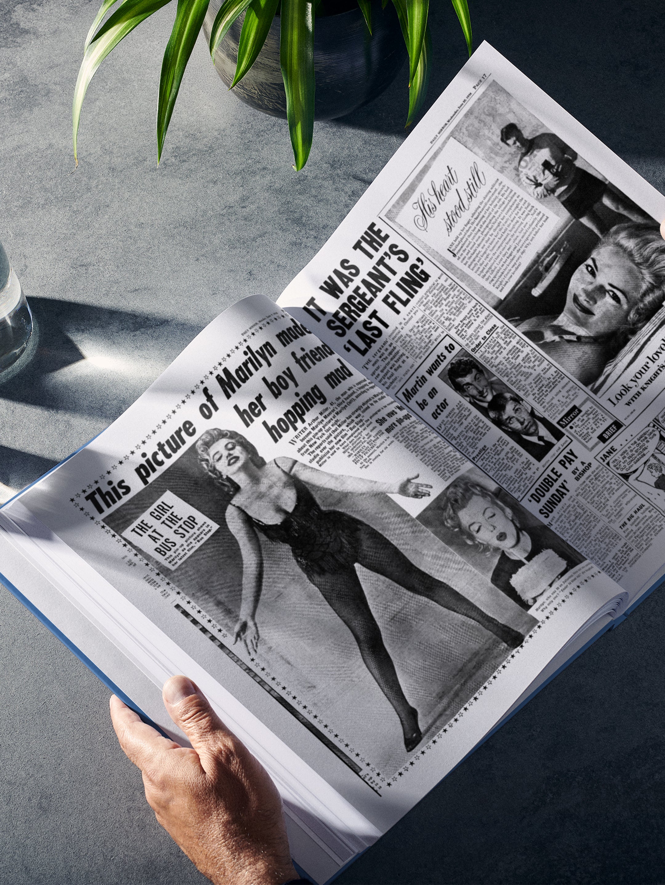 Open copy of "Your Year in Headlines 1956" POD book by Historic Newspapers showing historic newspaper spreads in blue.